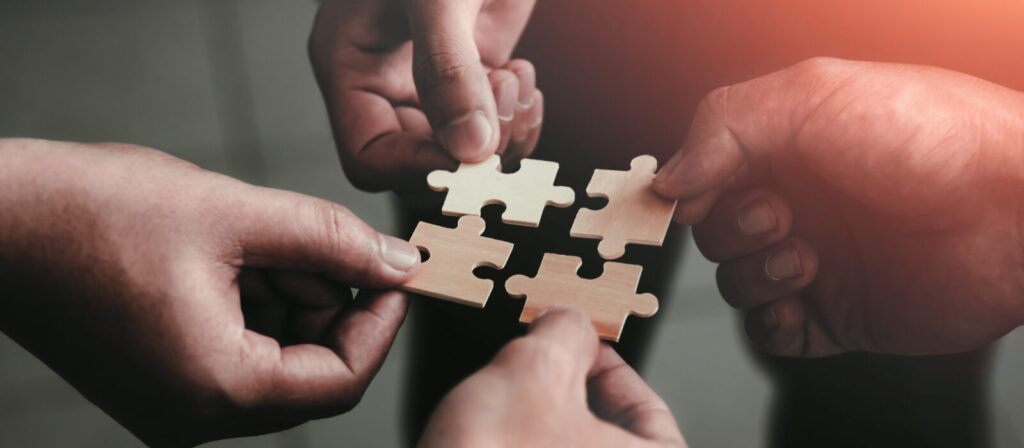mobile jigsaw puzzle pieces business cooperation concept teamwork and cooperation Businessmen join a jigsaw team, charity, volunteerism, unity, teamwork.