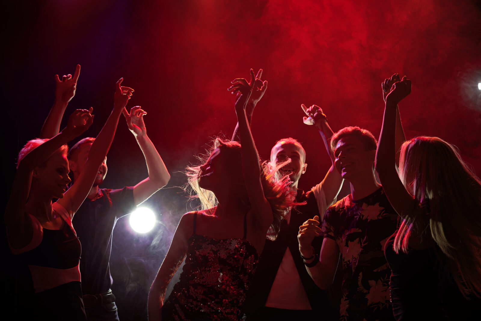 Group of teenagers having fun at nightclub